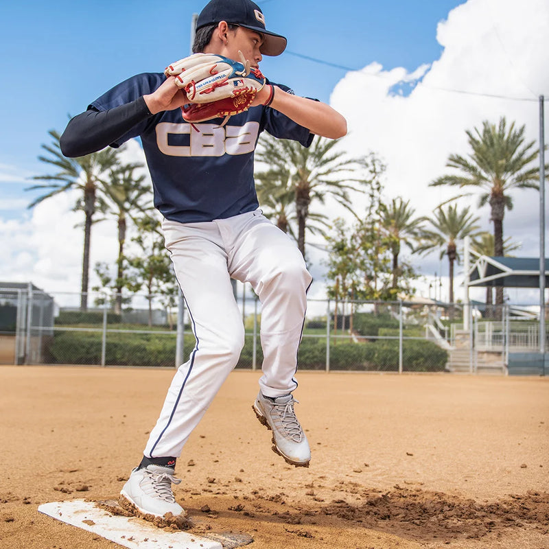 Youth Baseball Player Pitching on the Mound Wearing McDavid Protective Gear