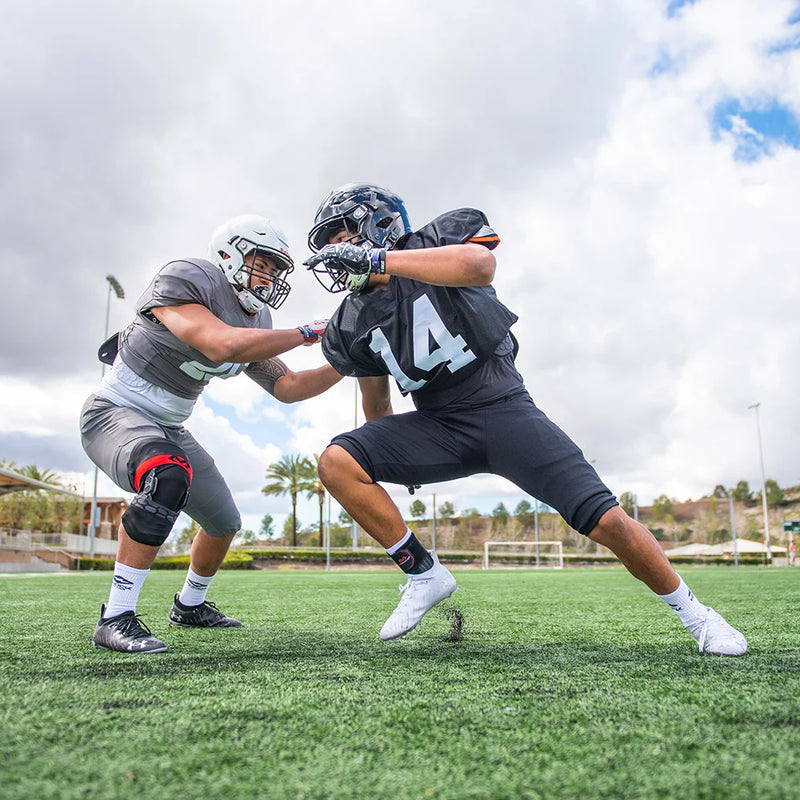 Tackle Football Players Wearing McDavid Protective Braces & Supports