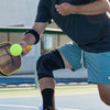 Lifestyle Image of Pickleball Player Wearing McDavid Knee Sleeve/4-Way Elastic