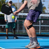 Lifestyle Image of Pickleball Player Wearing McDavid Knee Strap/Patella