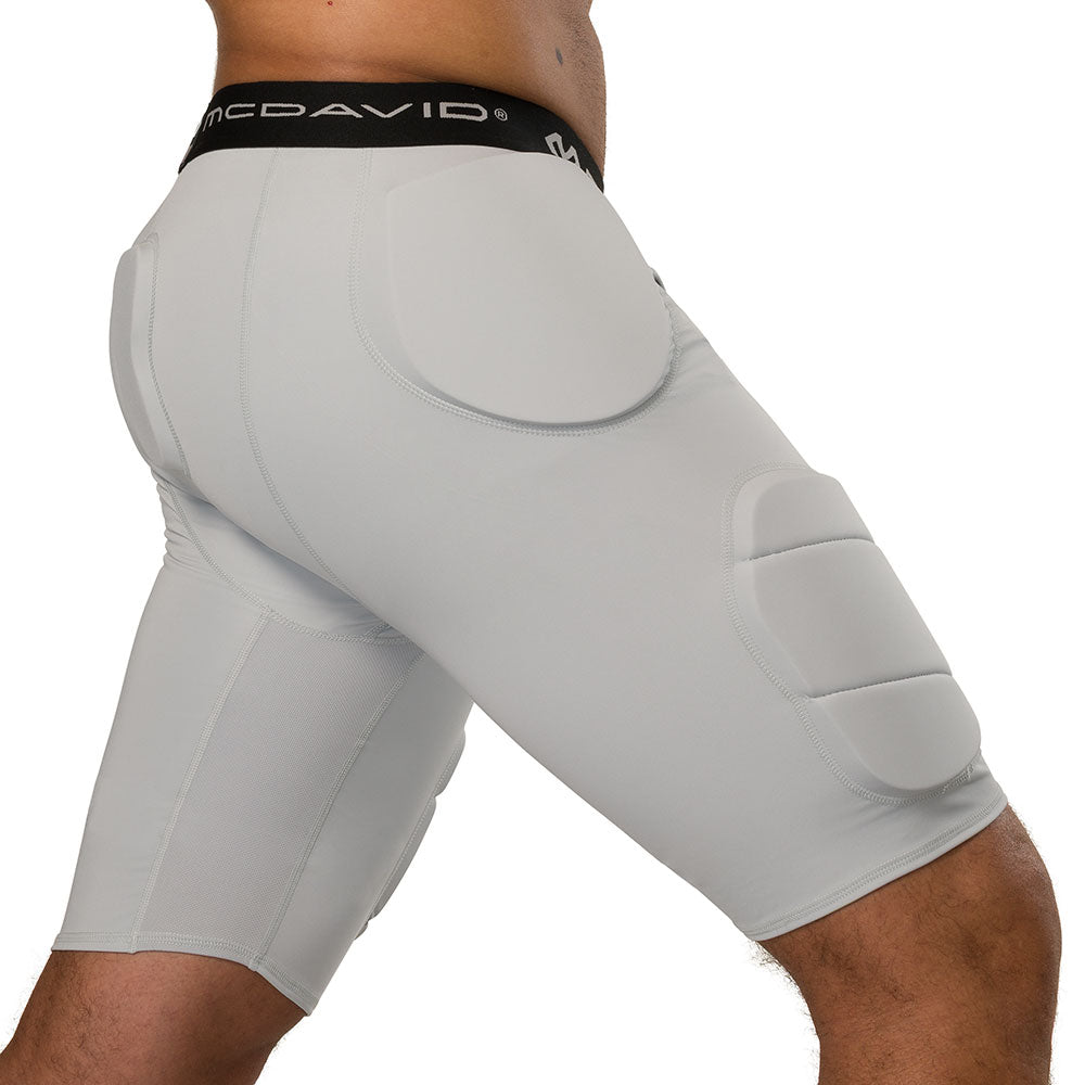 McDavid Rival Integrated 5-Pad Girdle in grey, three-quarter side view on model showing hip and thigh pad placement