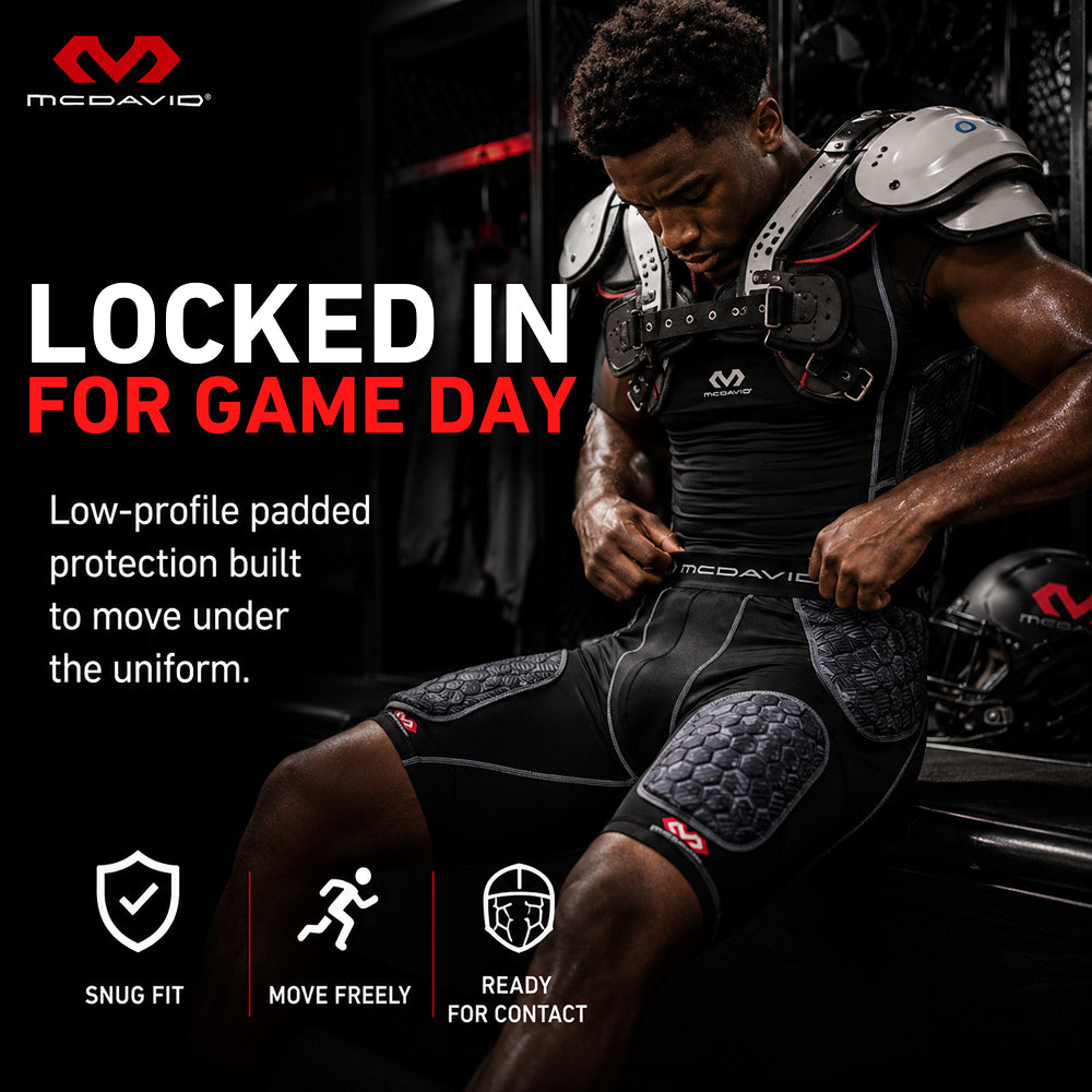 McDavid Rival Integrated 5-Pad Girdle in black worn under football uniform, showing snug fit, freedom of movement, and contact-ready protection