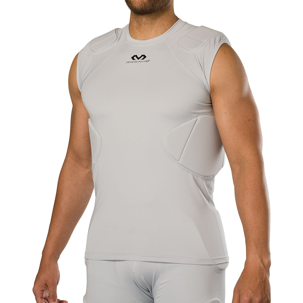 McDavid Rival 5-Pad Integrated Compression Shirt in grey, three-quarter front view on model showing shoulder and rib pad fit