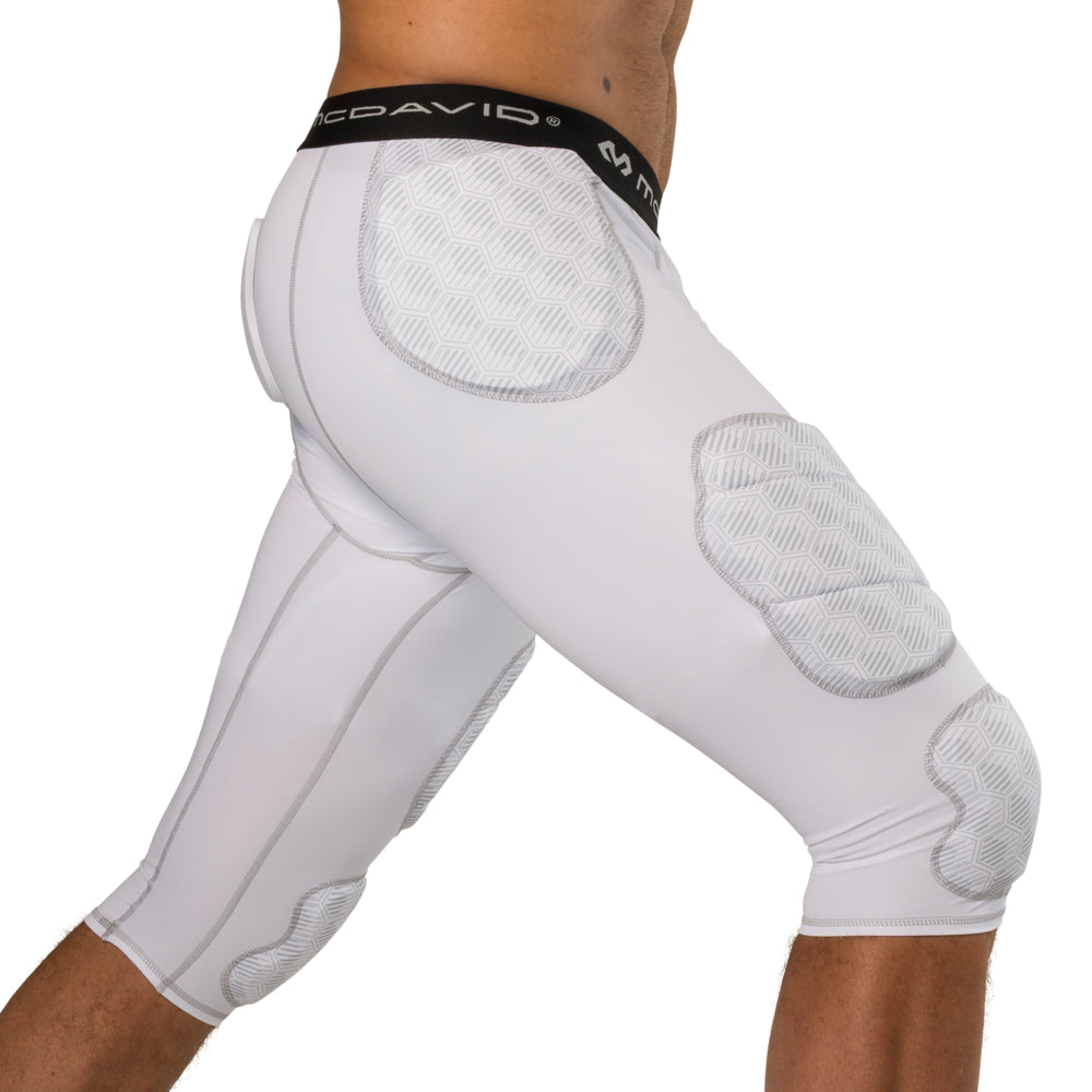 McDavid Rival Integrated 7-Pad ¾ Tight in white, three-quarter side view on model showing hip, thigh and knee pad placement