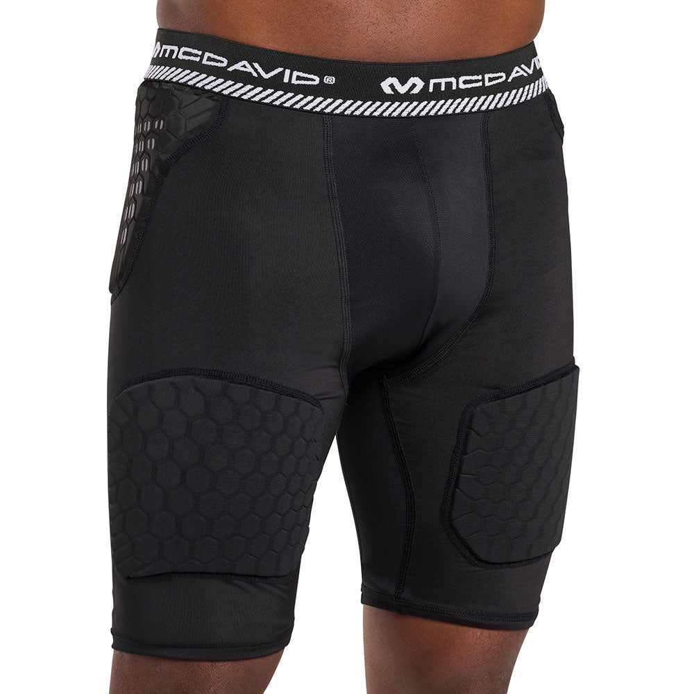 Front view of McDavid HEX® Viz 5-Pad Black Short on model, showing hip pad placement, contoured cup pocket and thigh pad