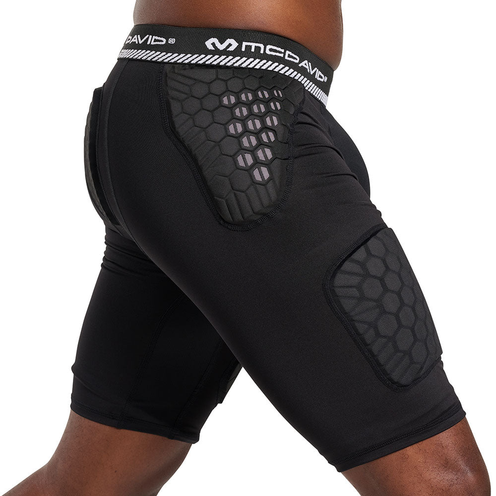 Side view of McDavid HEX® Viz 5-Pad Black Short on model, showing hip and thigh pad placement