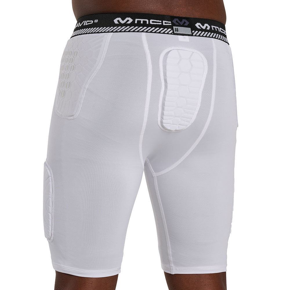 Back view of McDavid HEX® Viz 5-Pad White Short on model, showing hex-pattern hip and tailbone pads with McDavid logo waistband