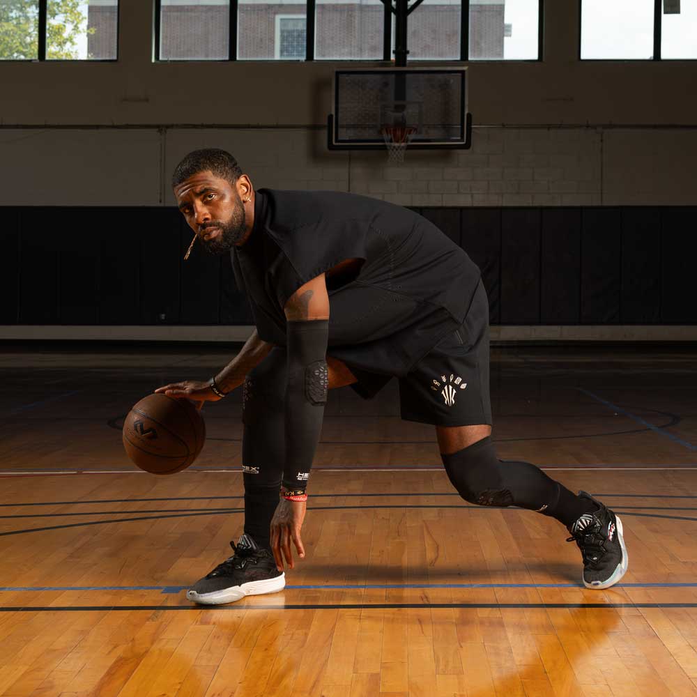 Kyrie Irving, Top NBA Basketball Start, wearing HEX® Viz Arm Sleeve/Single & Leg Sleeves while Holding Basketball
