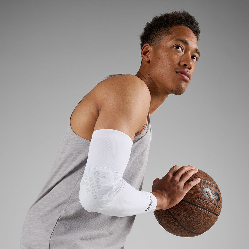 McDavid HEX Viz Arm Sleeve/Single - White/Grey - Athlete Holding Basketball Wearing Arm Sleeve