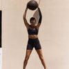McDavid Infused Therapy Buttersoft Arm Sleeve - Athlete wearing arm sleeve while exercising