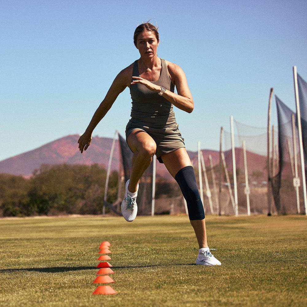 McDavid Infused Therapy Buttersoft Knee Sleeve - Athlete wearing knee sleeve while exercising