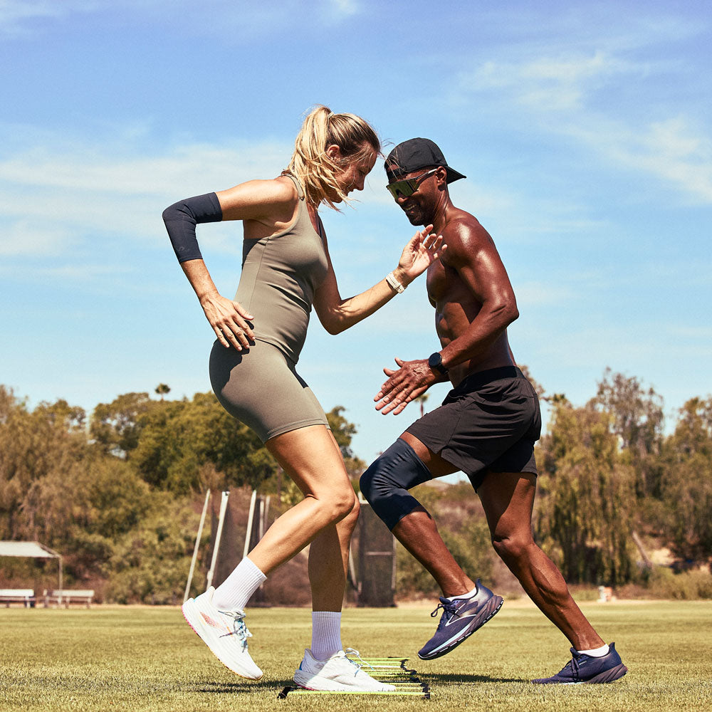 McDavid Infused Therapy Buttersoft Knee Sleeve - Athletes wearing knee sleeve  and elbow sleeve while exercising