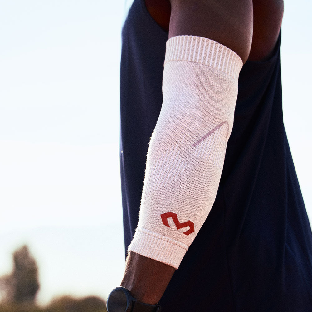 McDavid Infused Knit Elbow Sleeve - Grey- Shown on Athlete's Elbow - Side View