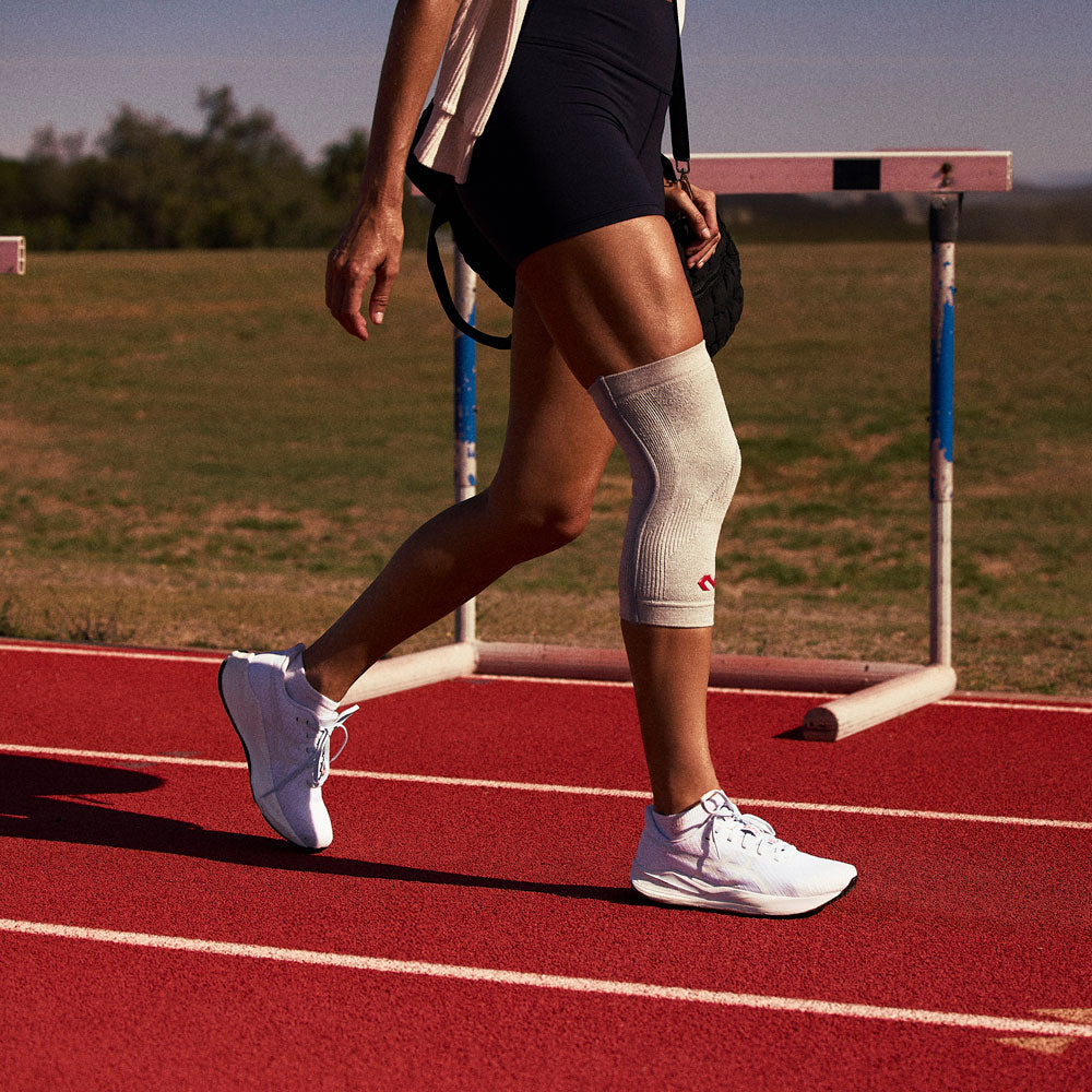 McDavid Infused Knit Knee Sleeve - Grey - Shown on Athlete's Knee While Exercising