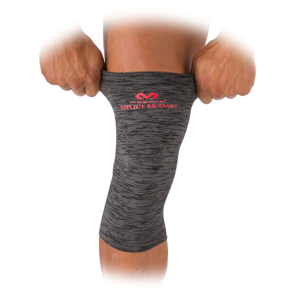 McDavid Reflect Infrared Recovery Compression Knee Sleeve -  On Model - Pulling Sleeve Over Knee