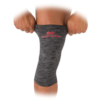 McDavid Reflect Infrared Recovery Compression Knee Sleeve -  On Model - Pulling Sleeve Over Knee