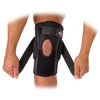 McDavid Phantom Knee Brace w/ Heavy Duty Hinges - Black - On Model - Pulling Adjustable Straps