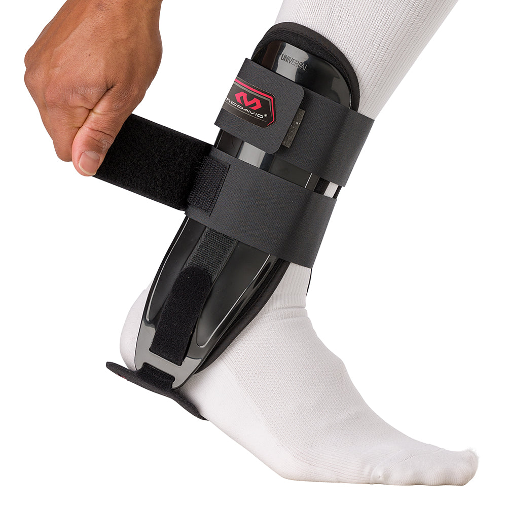 McDavid Ankle Splint - Black - On Model - Front View - Tightening Velcro Straps