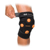 McDavid MYVOLT® Wearable Vibration Recovery Knee/Leg Wrap - On Model - Front View - Tightening Strap for Ideal Fit