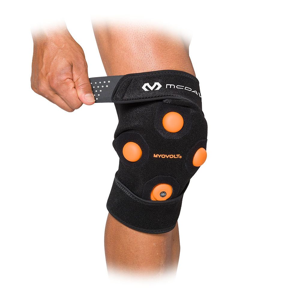 McDavid MYVOLT® Wearable Vibration Recovery Knee/Leg Wrap - On Model - Front View - Tightening Strap for Ideal Fit