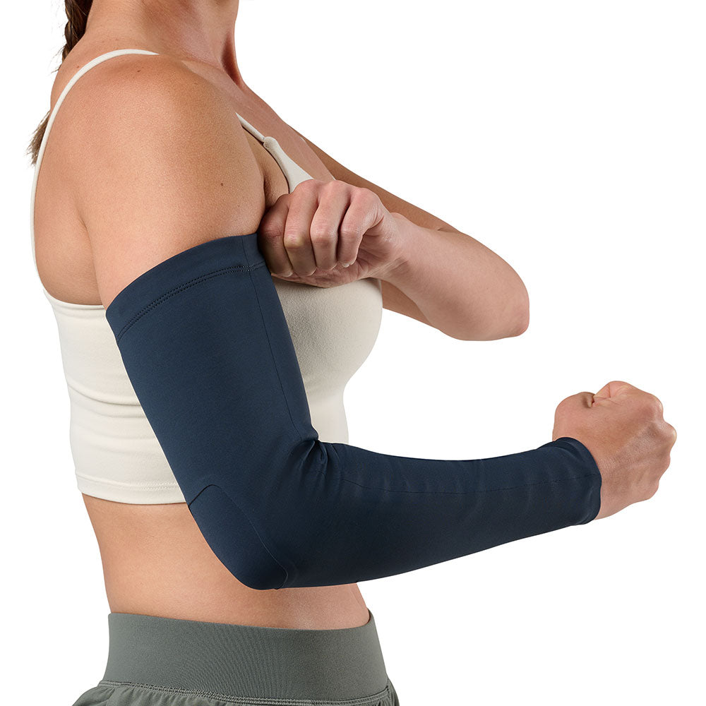 McDavid Infused Therapy Buttersoft Arm Sleeve - Model showing Arm sleeve while clenching fist