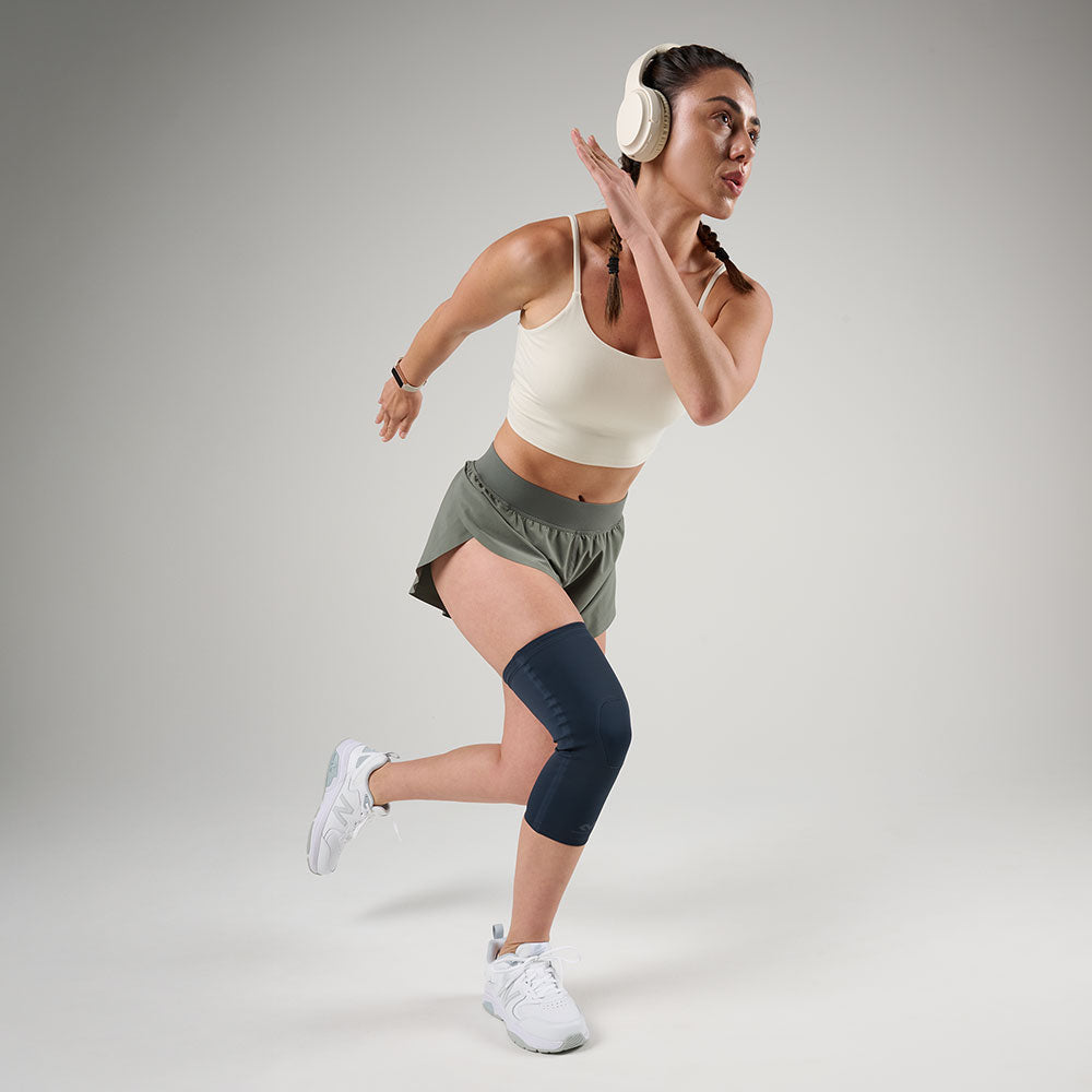 McDavid Infused Therapy Buttersoft Knee Sleeve - Athlete wearing knee sleeve while exercising