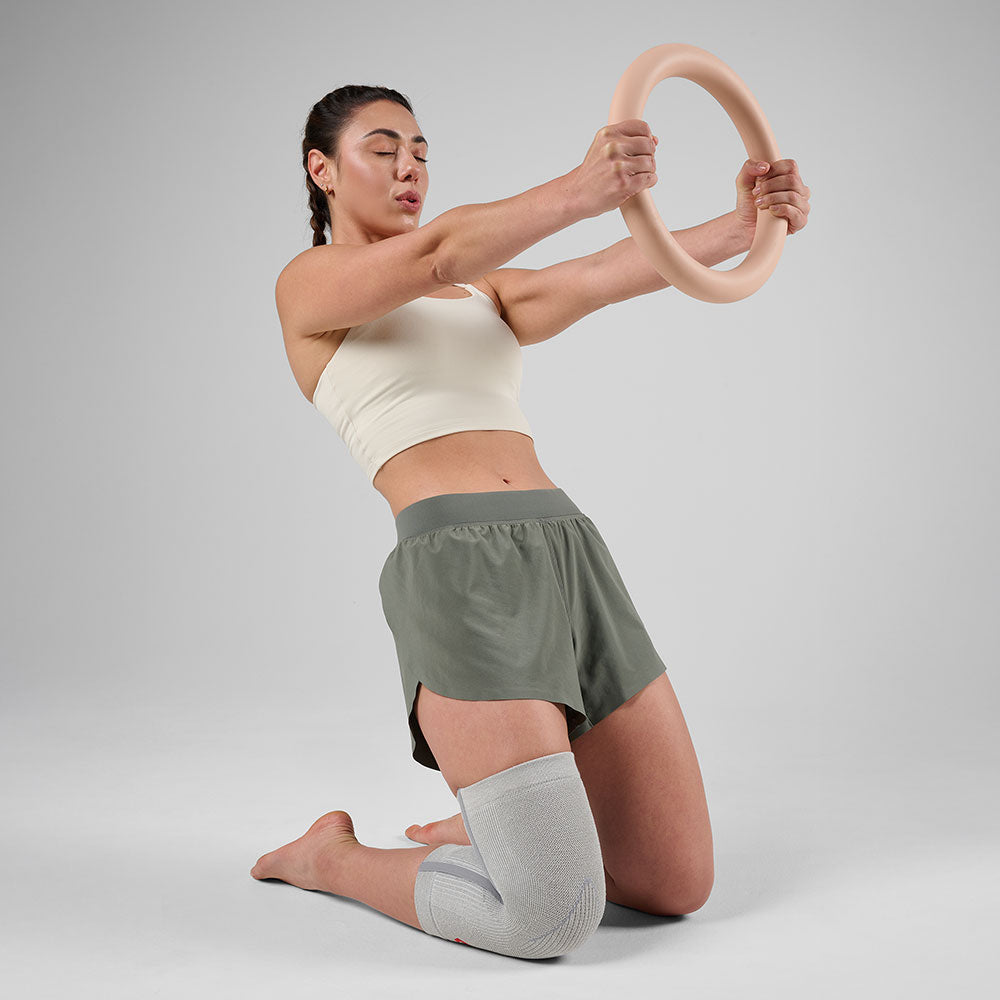 McDavid Infused Knit Knee Sleeve - Grey - Shown on Model's Knee While Exercising