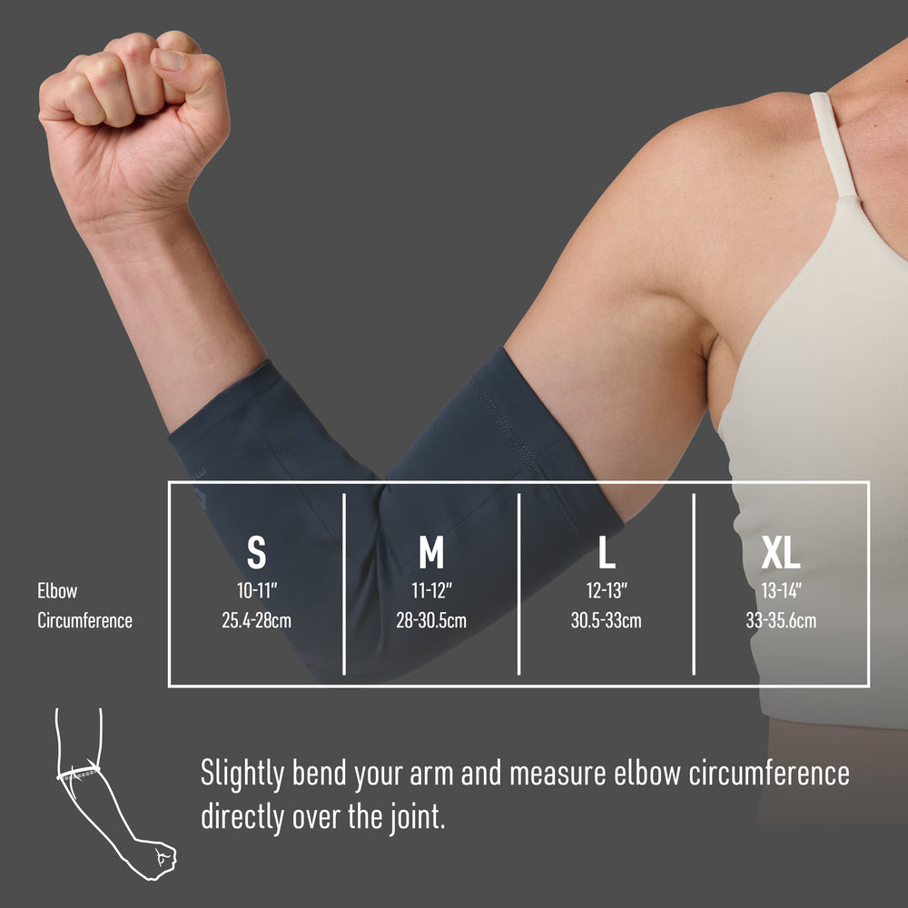 Woman's bent arm wearing a navy knit elbow sleeve, fist raised, next to a sizing chart showing elbow circumference ranges for sizes S (10-11 in / 25.4-28 cm), M (11-12 in / 28-30.5 cm), L (12-13 in / 30.5-33 cm), and XL (13-14 in / 33-35.6 cm), with an illustration showing how to measure elbow circumference by slightly bending the arm and measuring directly over the joint.