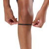 McDavid Silicone Patella Band Pair - Black - Shown on Model Pulling up Band on Knee