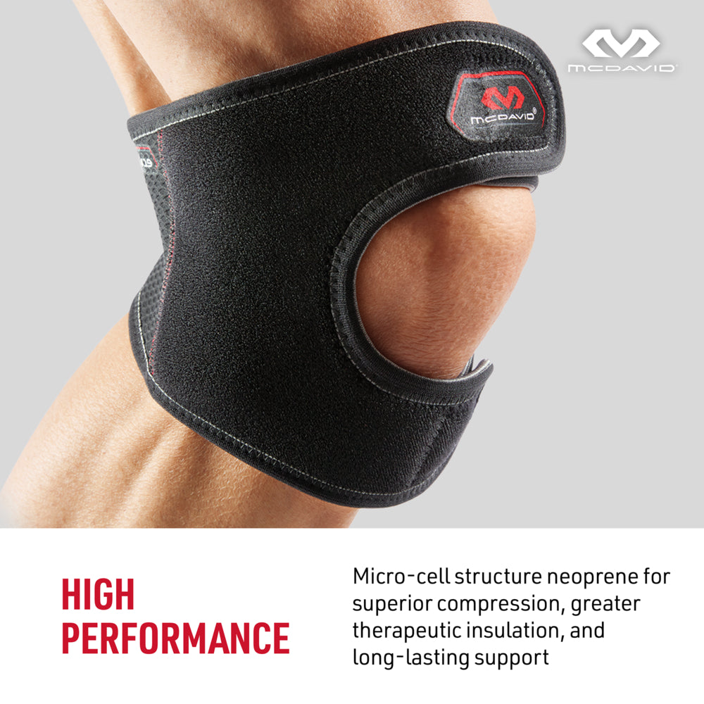 Close-up of McDavid Knee Support/Adjustable Brace with Open Patella design, worn on leg. Text reads: 'High Performance – Micro-cell structure neoprene for superior compression, greater therapeutic insulation, and long-lasting support.' McDavid logo in the corner.