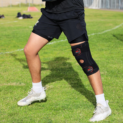Lifestyle Image of Lacrosse Player Wearing McDavid Knee Support with Stays