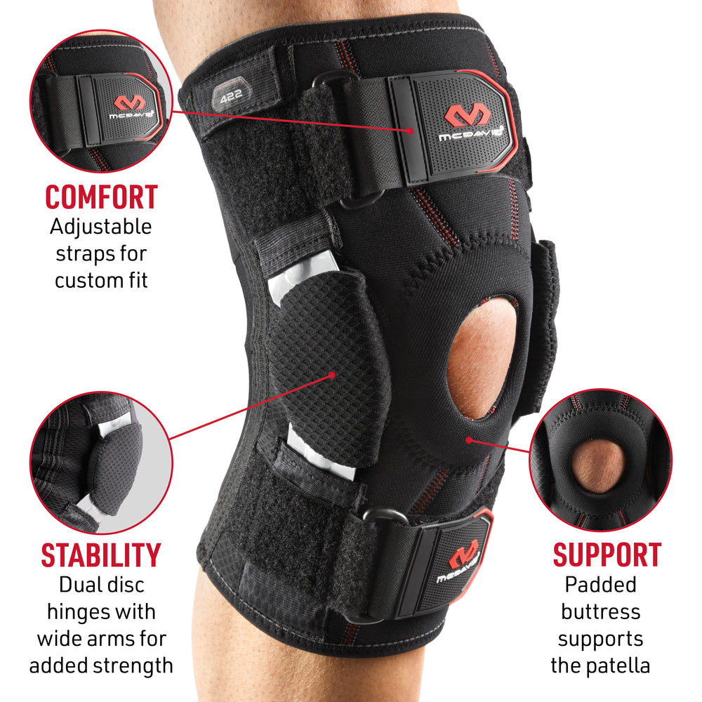 McDavid Knee Brace with Dual Disk Hinges worn on a knee, with callouts highlighting adjustable comfort straps, dual disc stability hinges, and a padded support buttress around the patella opening