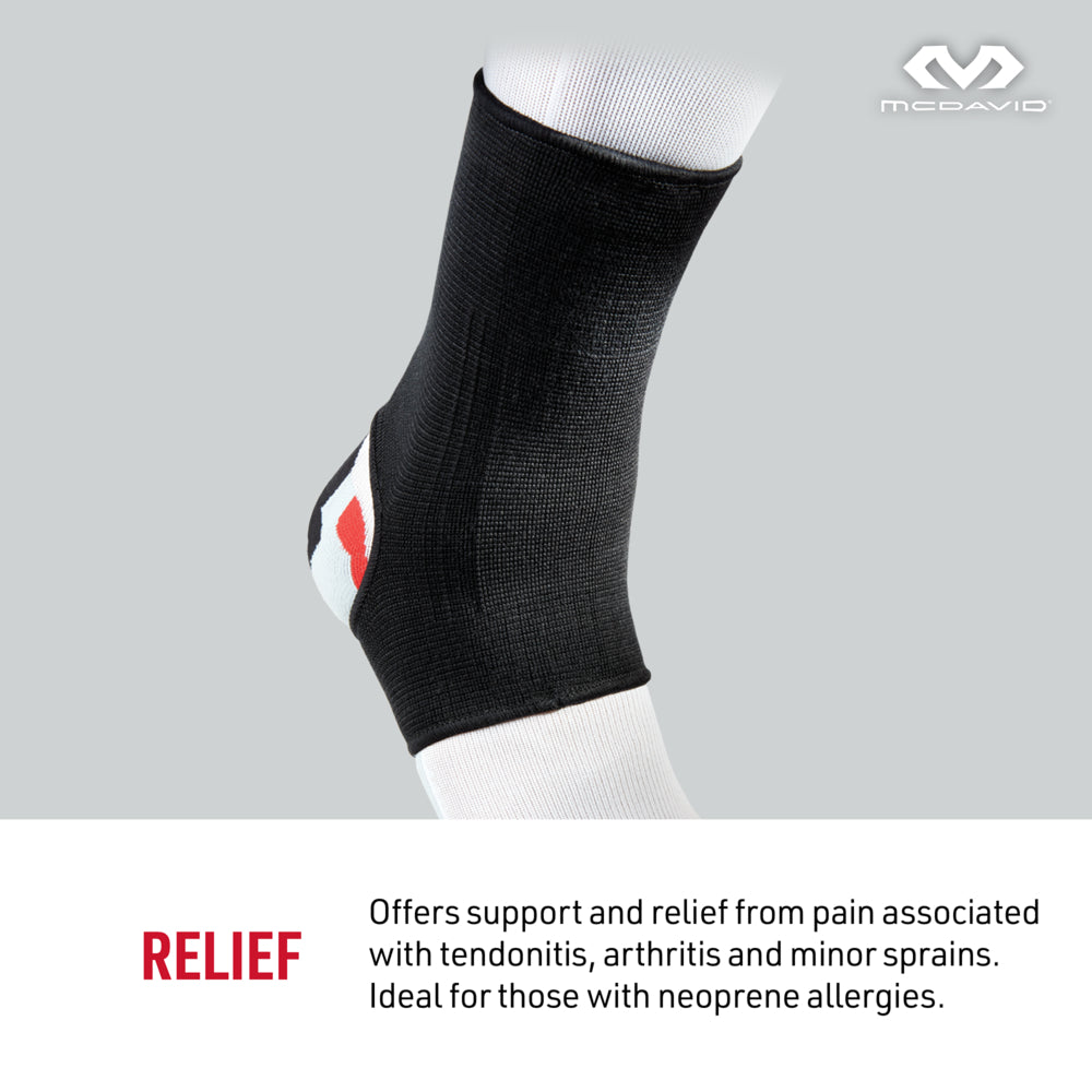 McDavid Ankle Sleeve/Elastic shown worn on ankle, designed for everyday support and pain relief from arthritis, bursitis, and tendonitis. Lightweight, breathable sleeve for light activity and all-day wear. Features black elastic construction and McDavid logo.