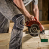 Lifestyle Image of Contractor using Circular Saw to Cut Wood While Wearing the McDavid Neoprene Dual Wrap Knee Support with Abrasion Patch