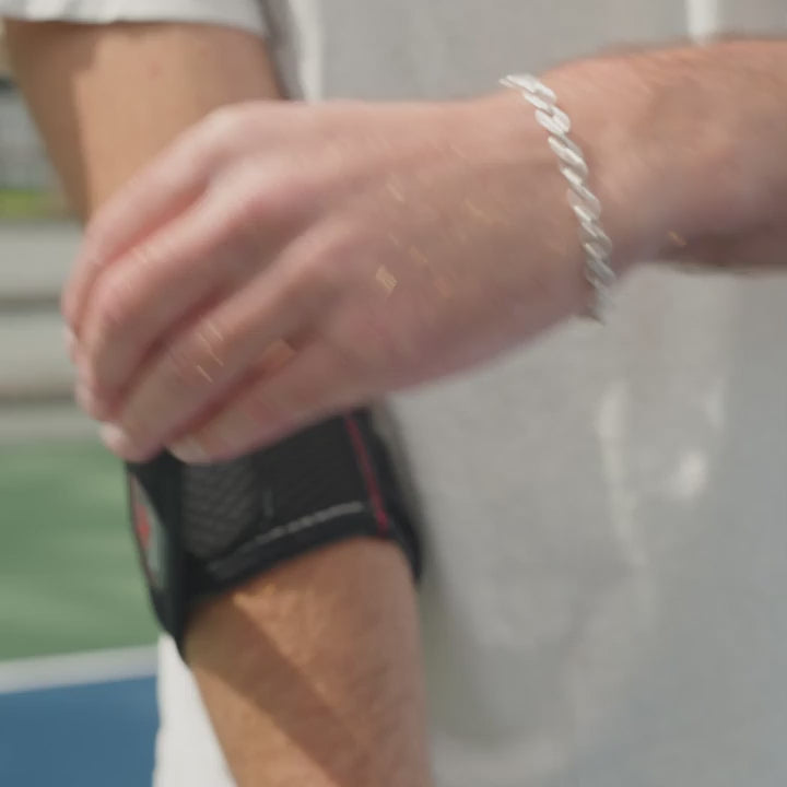 McDavid Elbow Strap with Pads worn on the forearm just below the elbow