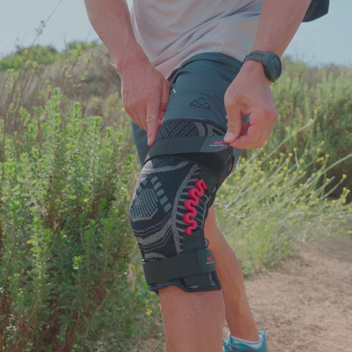 McDavid NRG Lightweight Knit Knee Sleeve with spring hinges worn on the knee for lightweight support