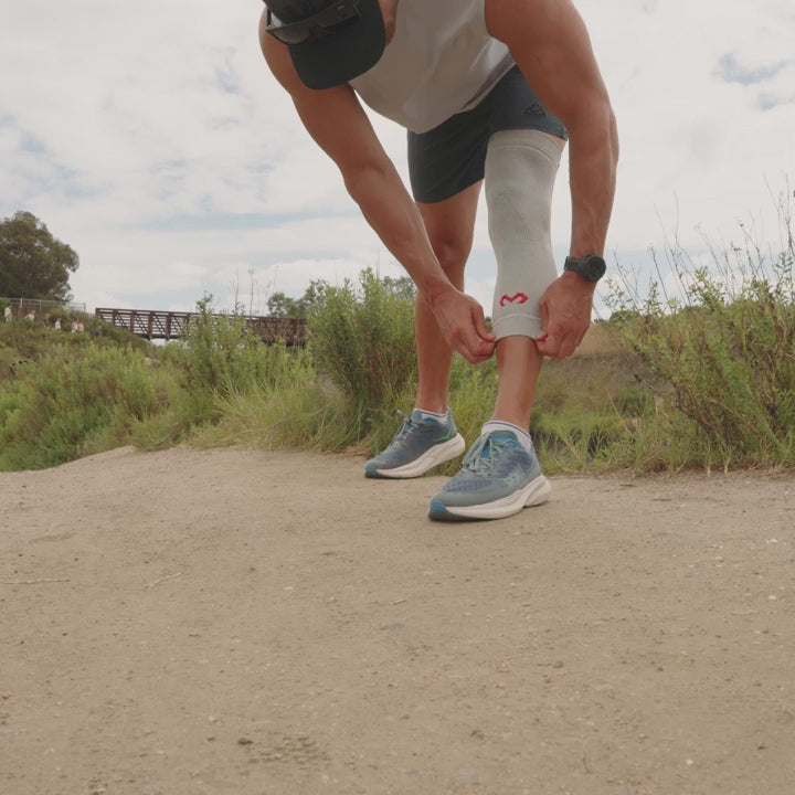 McDavid Infused Therapy Knit Knee Sleeve with stays worn on the knee for compression and support