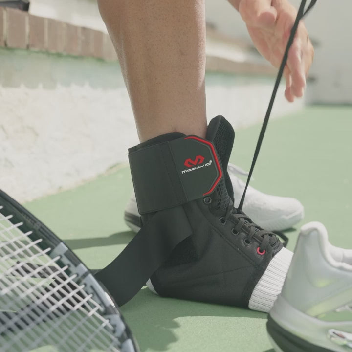 McDavid Ankle Brace with Straps worn on the ankle for support and stability