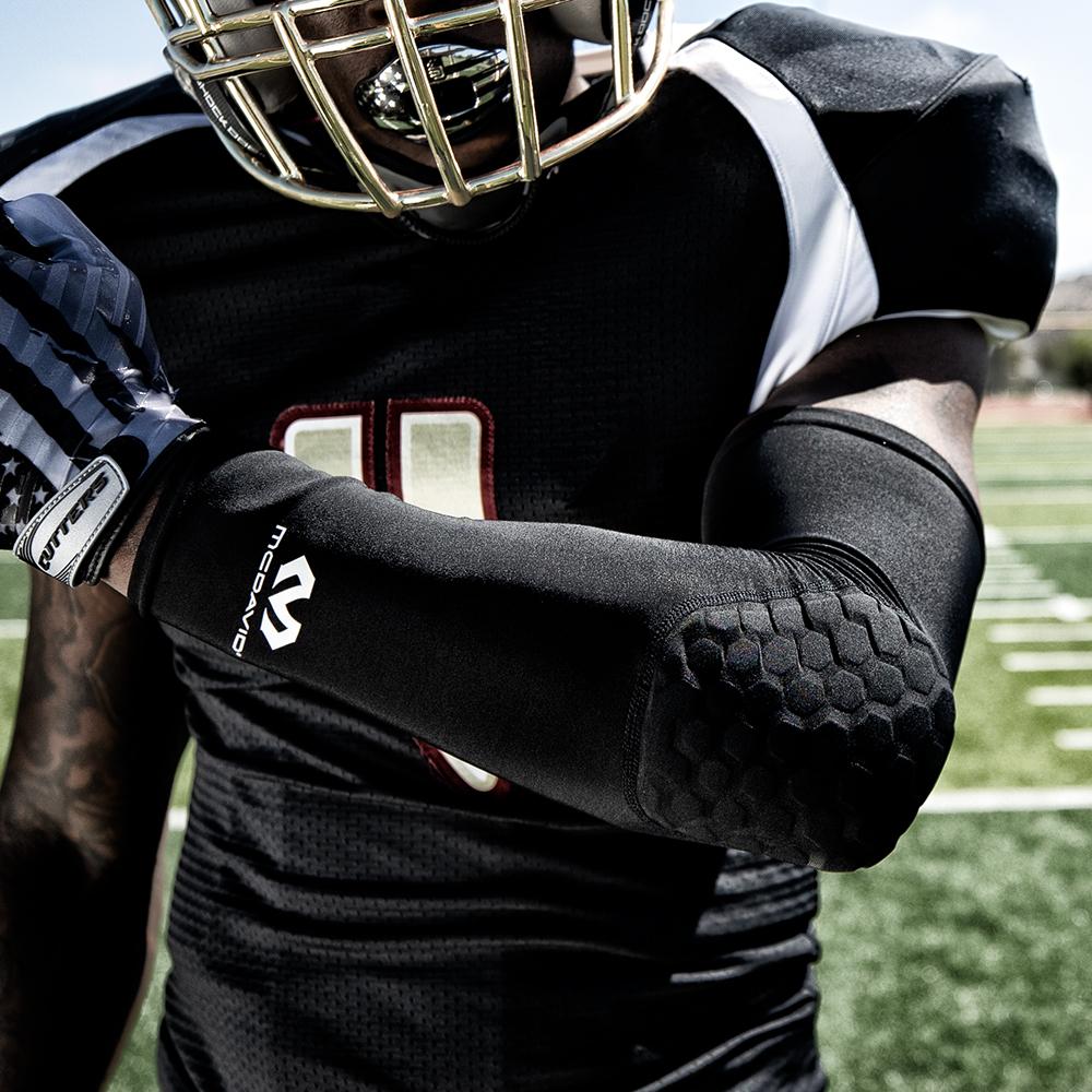 McDavid HEX® Shooter Arm Sleeve/Single Lifestyle Image - Youth Football Player Wearing HEX Shooter Arm Sleeve/Single