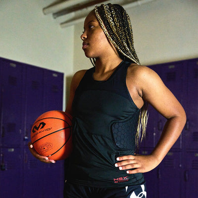 McDavid Women's HEX® 3-Pad Tank - Lifestyle Shot on Model - Female Basketball Player Wearing Protective Padded Shirt